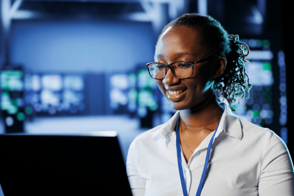 Tecunit specialist reviewing work in a modern IT environment
