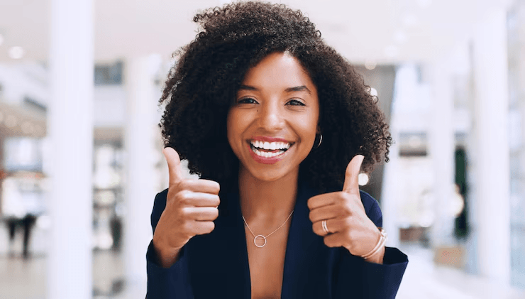 Satisfied Tecunit client giving a thumbs up in a modern office